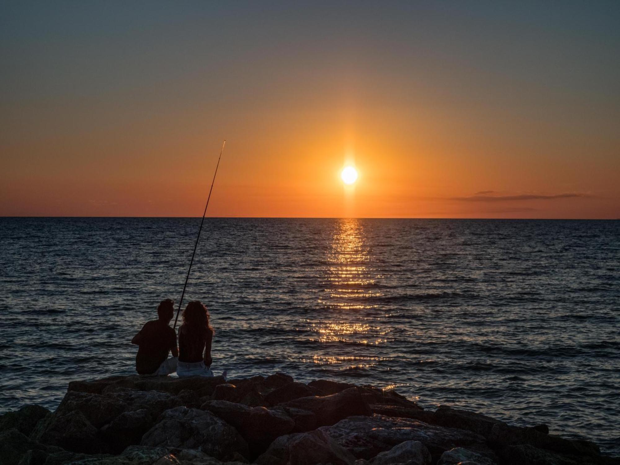 Gitavillage Argentario Albinia Kültér fotó Sunset at the Black Sea